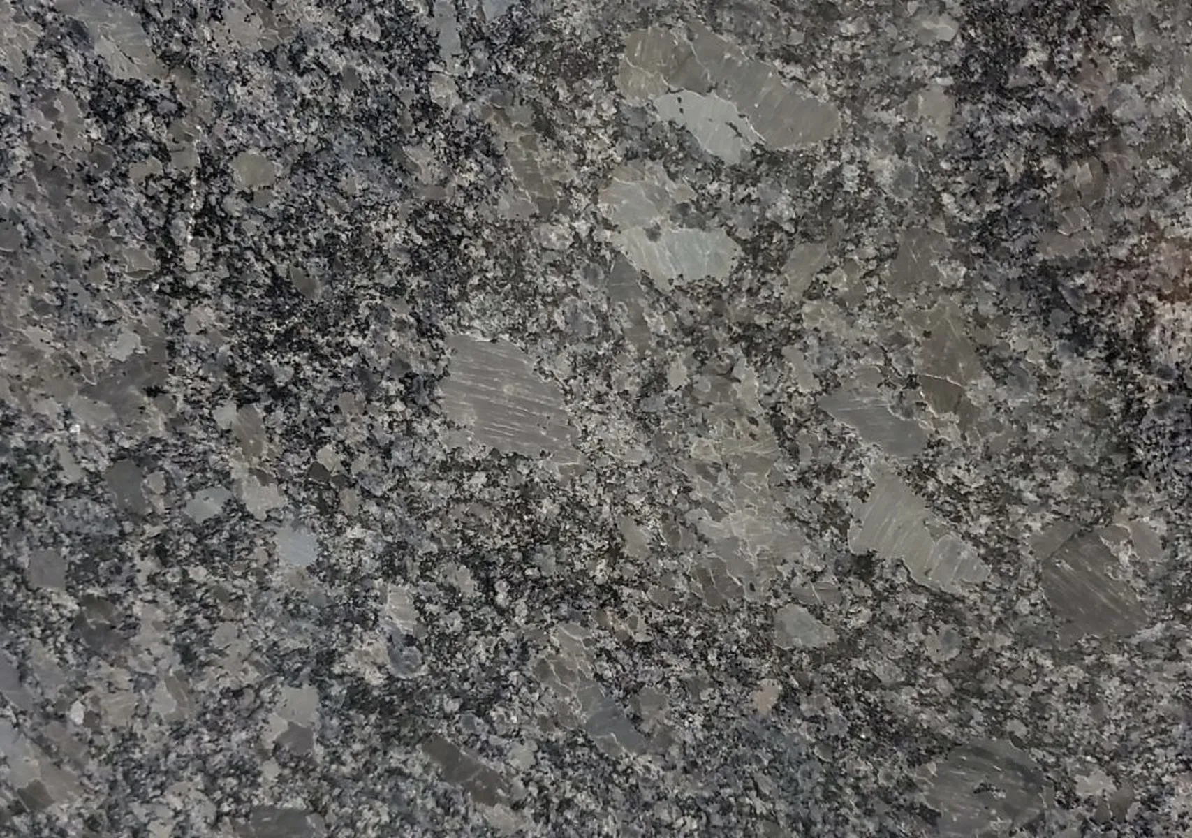 Closeup image of Steel Gray Grey Granite countertop slab