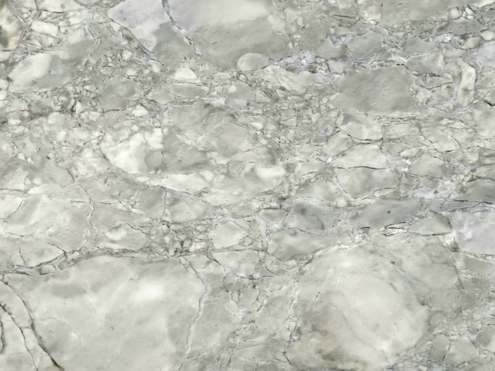 Closeup image of Super White Grey Soapstone countertop slab