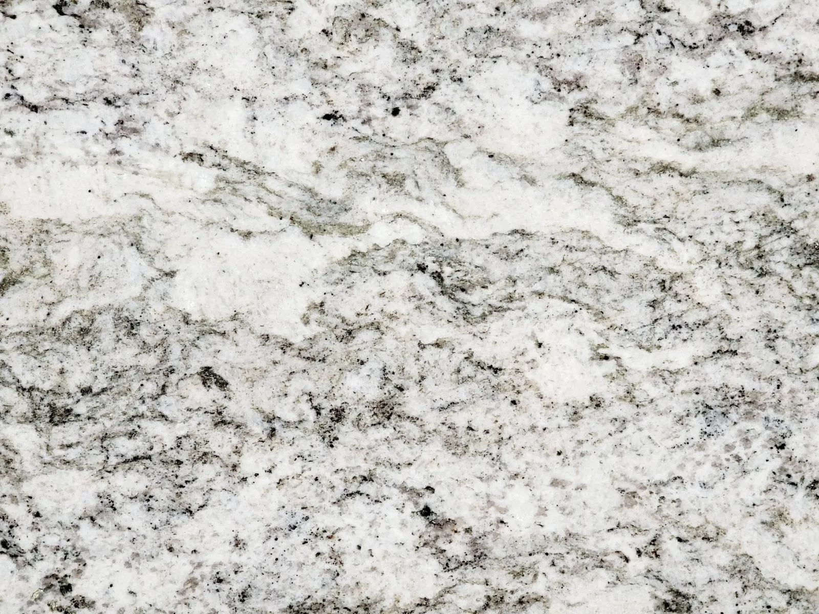 Closeup image of Taupe Gray White Granite countertop slab