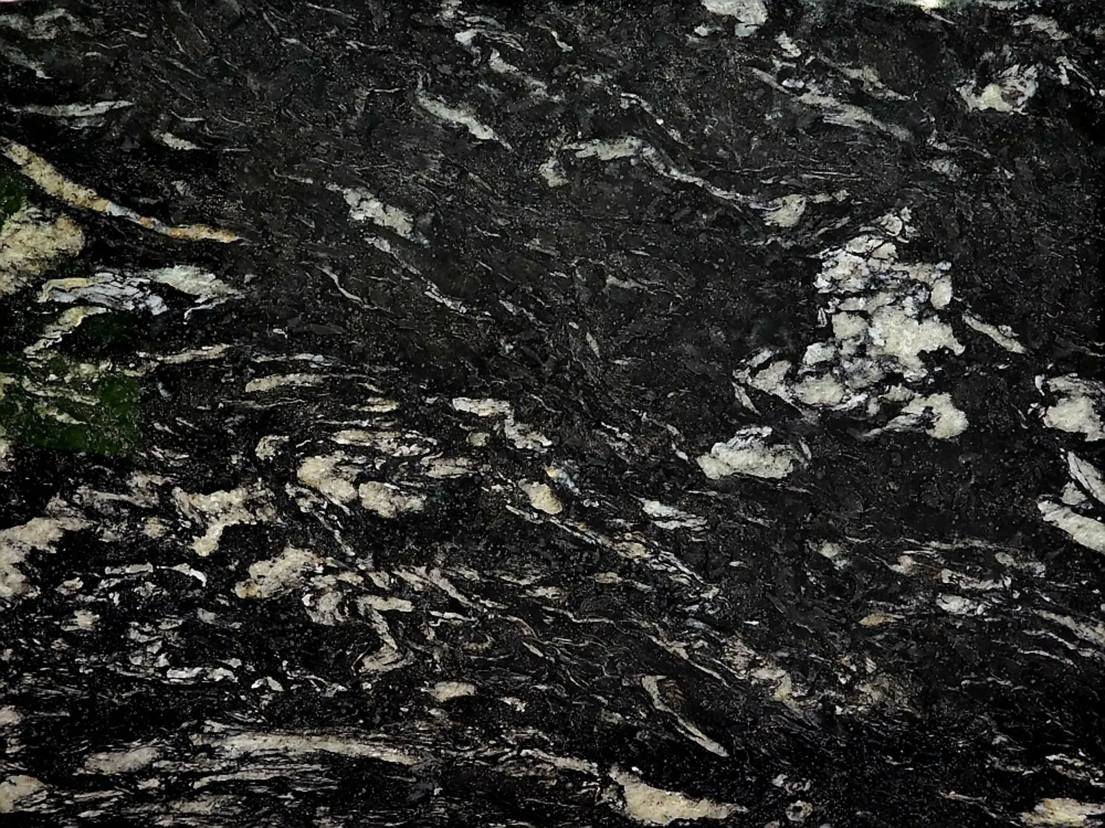 Closeup image of Tuxedo Black Black Granite countertop slab