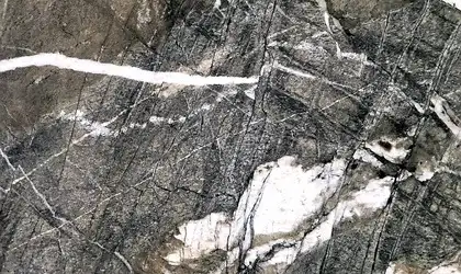 Closeup image of Victoria Brown Quartzite countertop slab