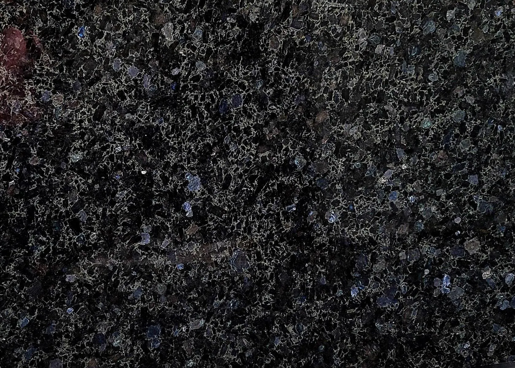 Closeup image of Volga Blue Black Granite countertop slab