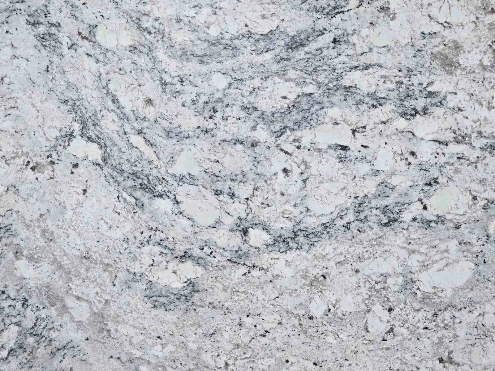 Closeup image of White Ice Premium Grey Granite countertop slab