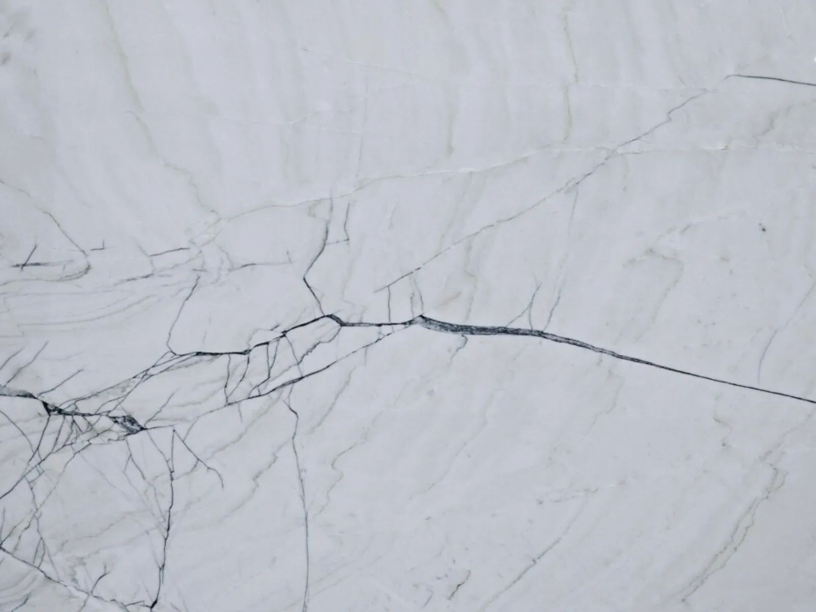Closeup image of White Lux White Quartzite countertop slab