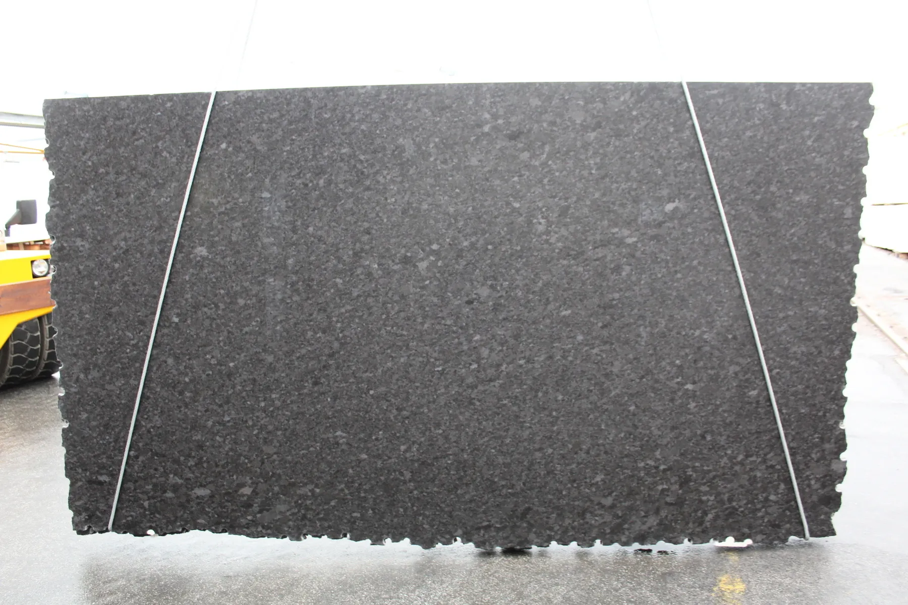 Closeup image of Brown Antique Black Granite countertop slab