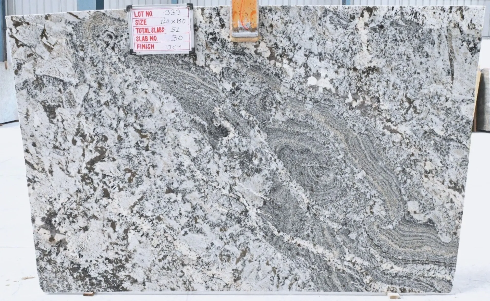 Closeup image of White Nuvo Grey Granite countertop slab