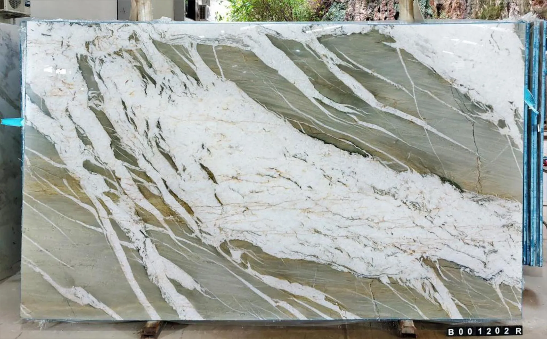 Closeup image of Raggio D Luna Green Quartzite countertop slab