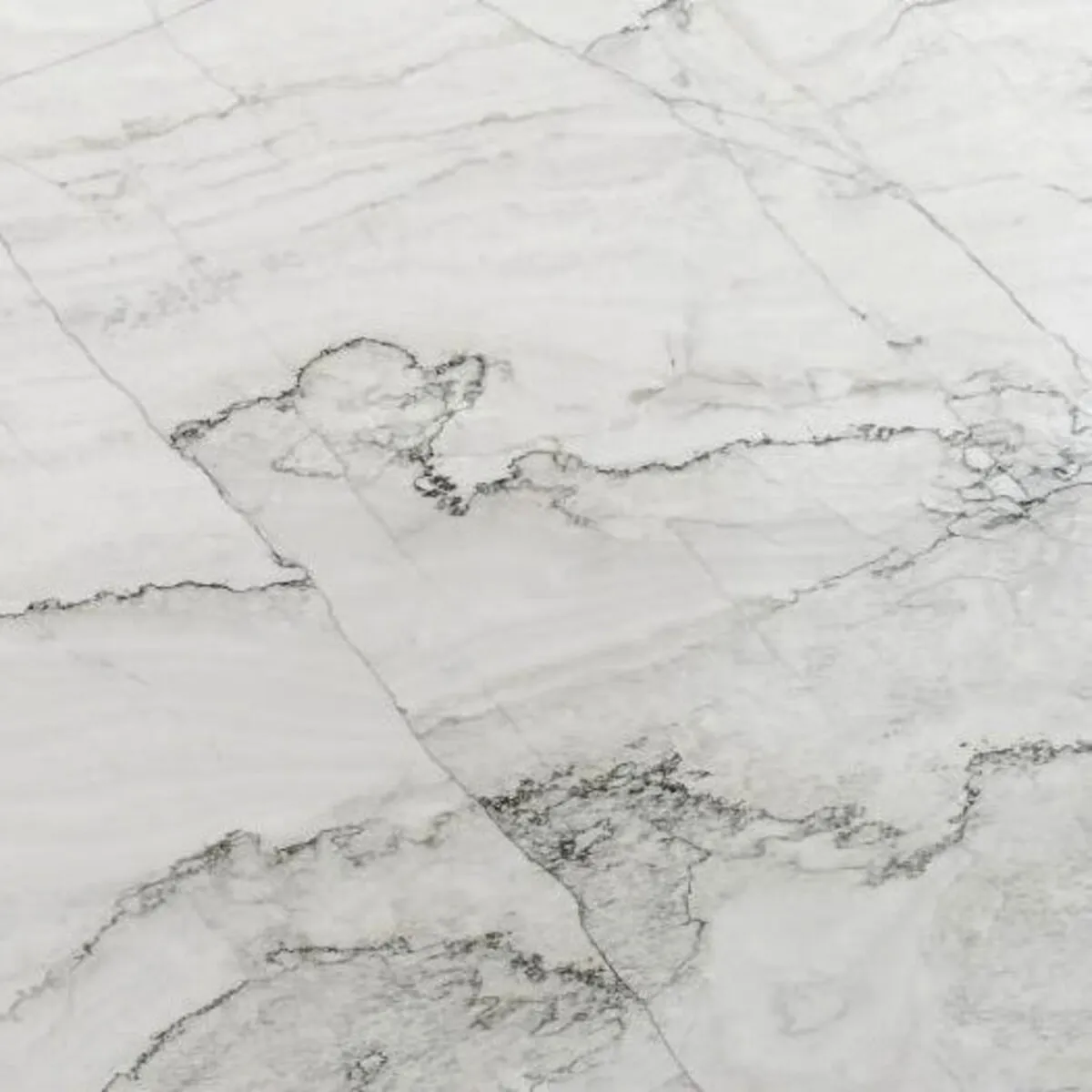Closeup image of Calacatta Supreme White Quartzite countertop slab