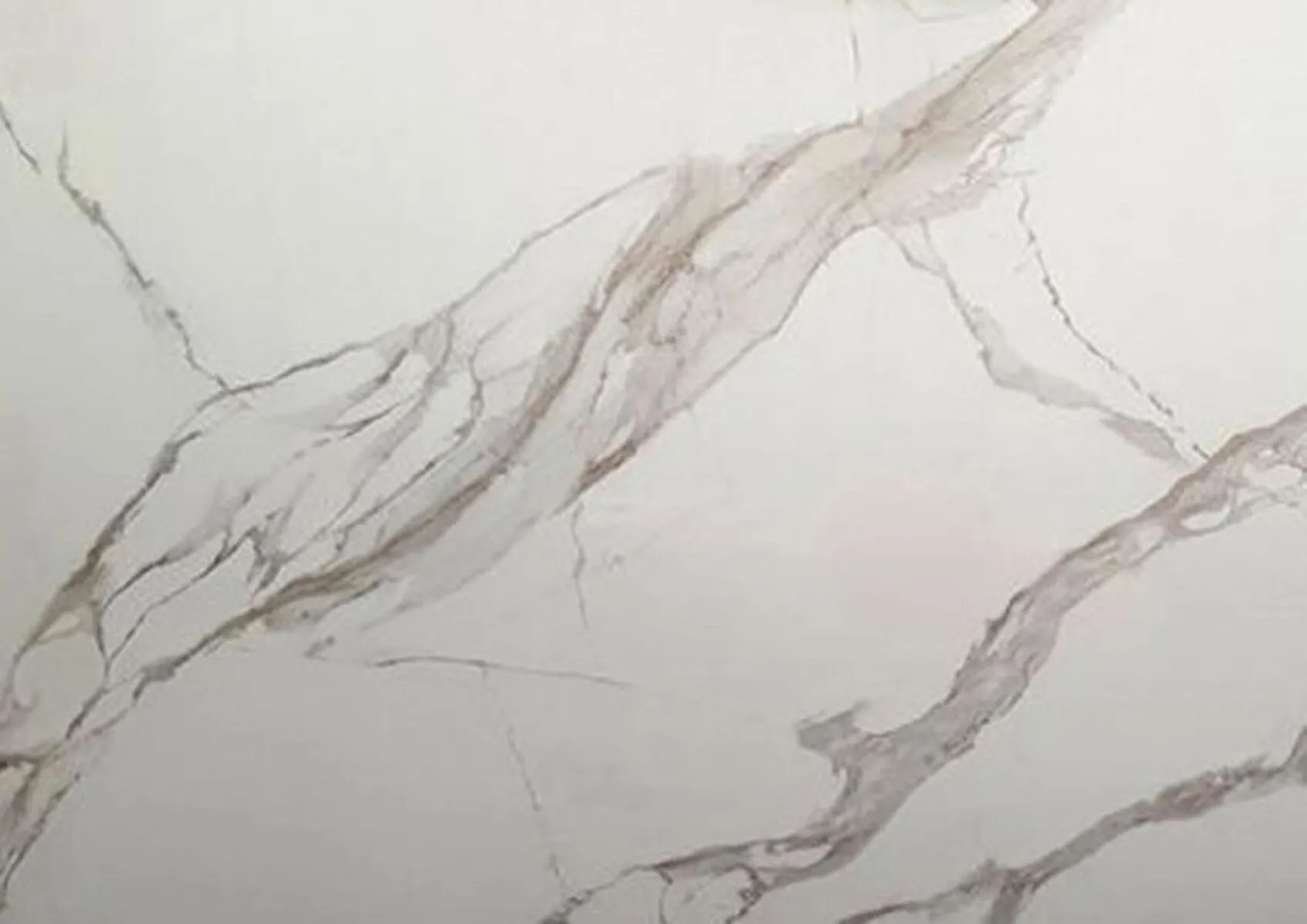 Closeup image of Aggranite Porcelain Calacatta Thick Vein Cream Porcelain countertop slab