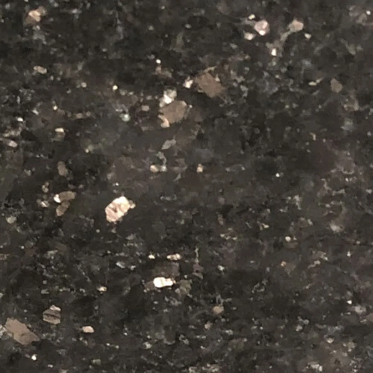 Closeup image of Galaxy Black Gold Black Granite countertop slab