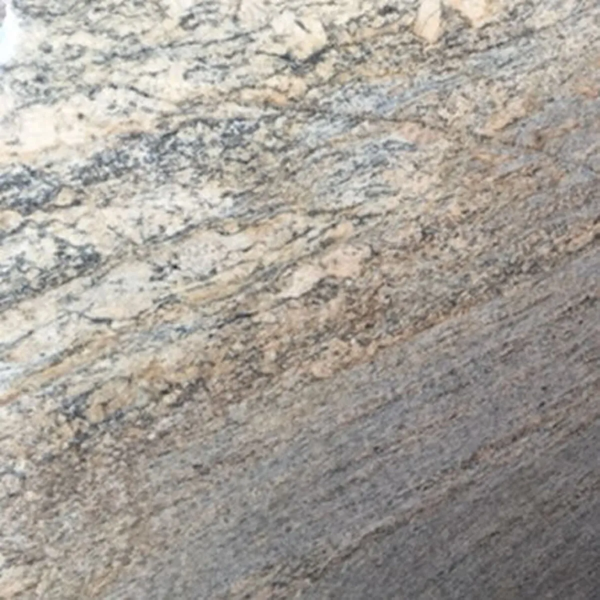 Closeup image of Juparana Golden Sun Beige Granite countertop slab