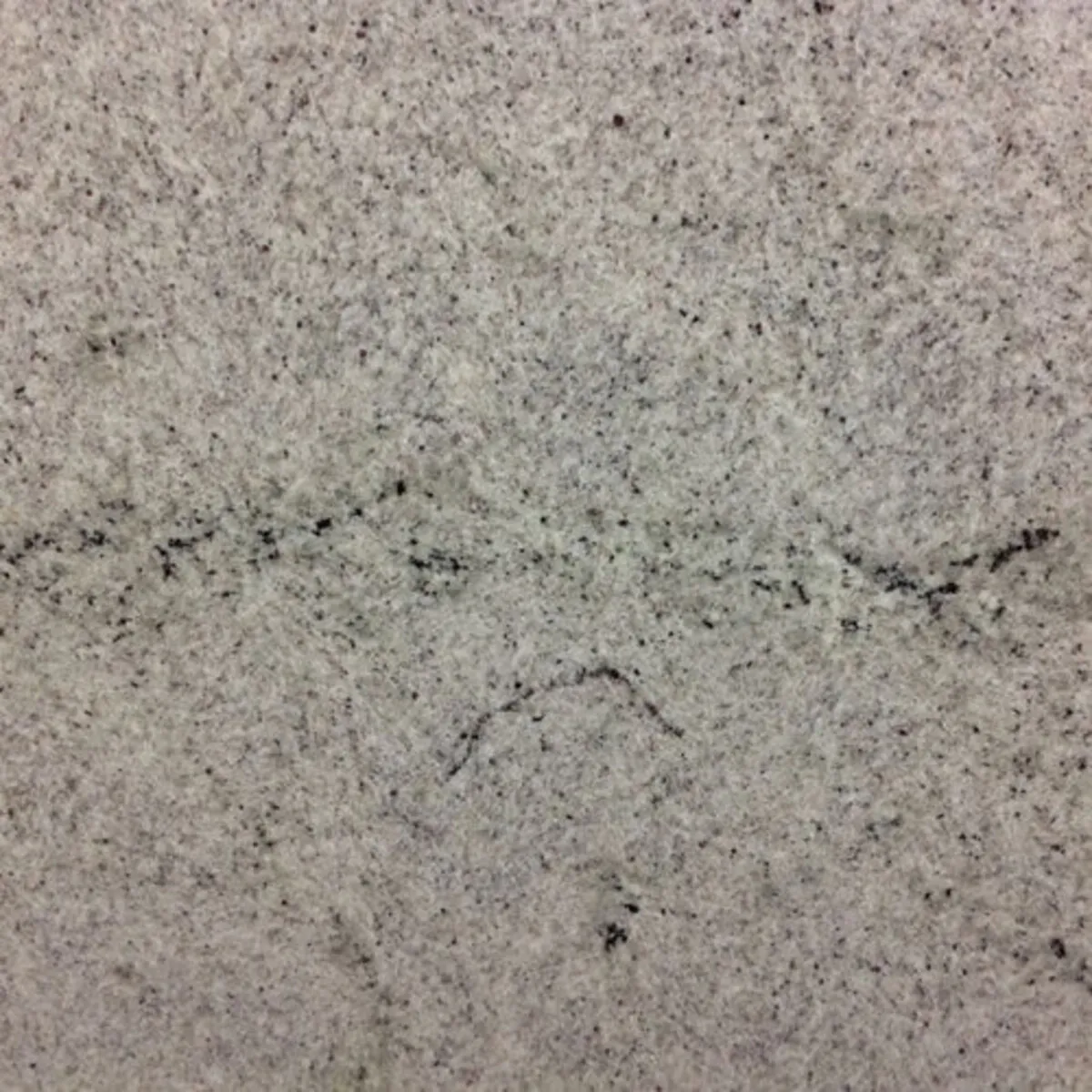 Closeup image of Kashmir White Cream Granite countertop slab