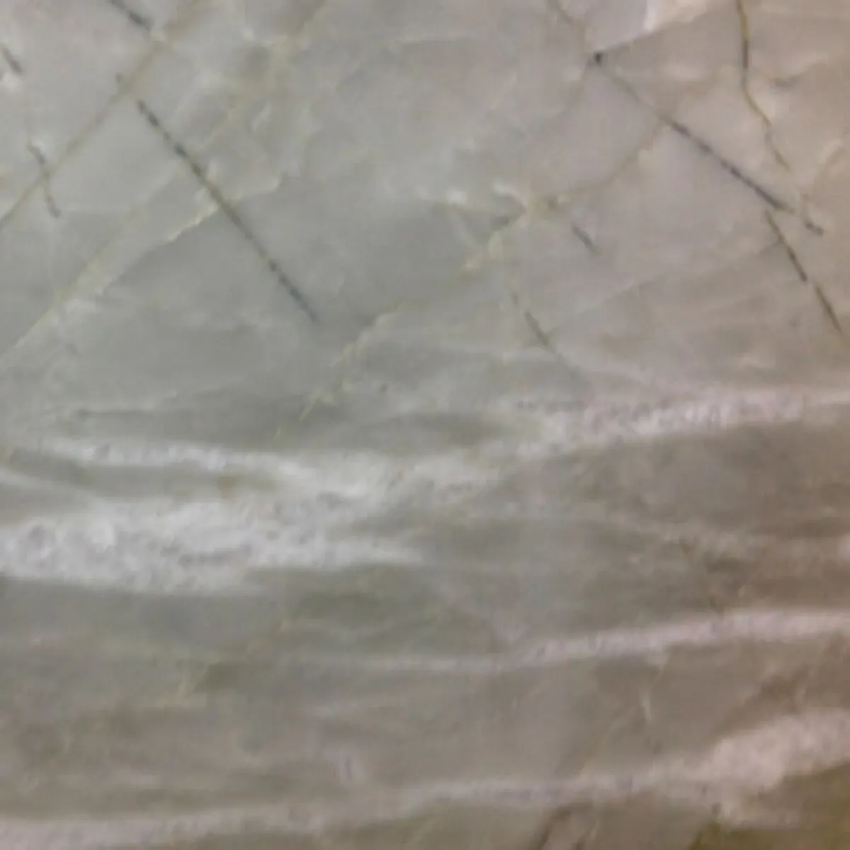 Closeup image of Nuage Grey Quartzite countertop slab