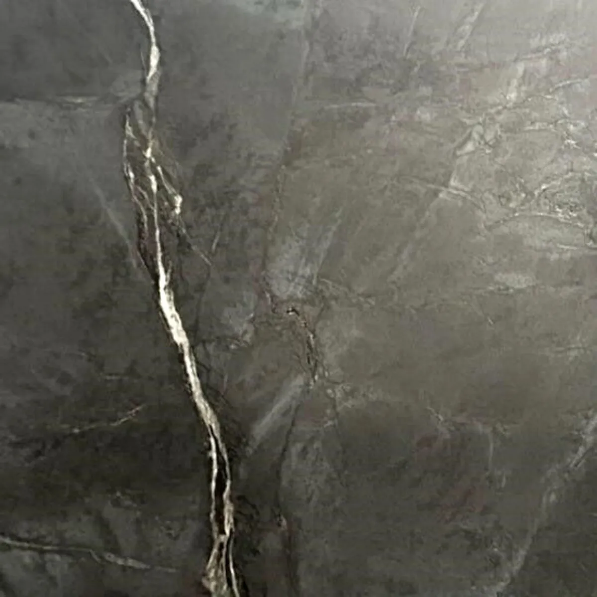 Closeup image of Black Soapstone Grey Quartzite countertop slab