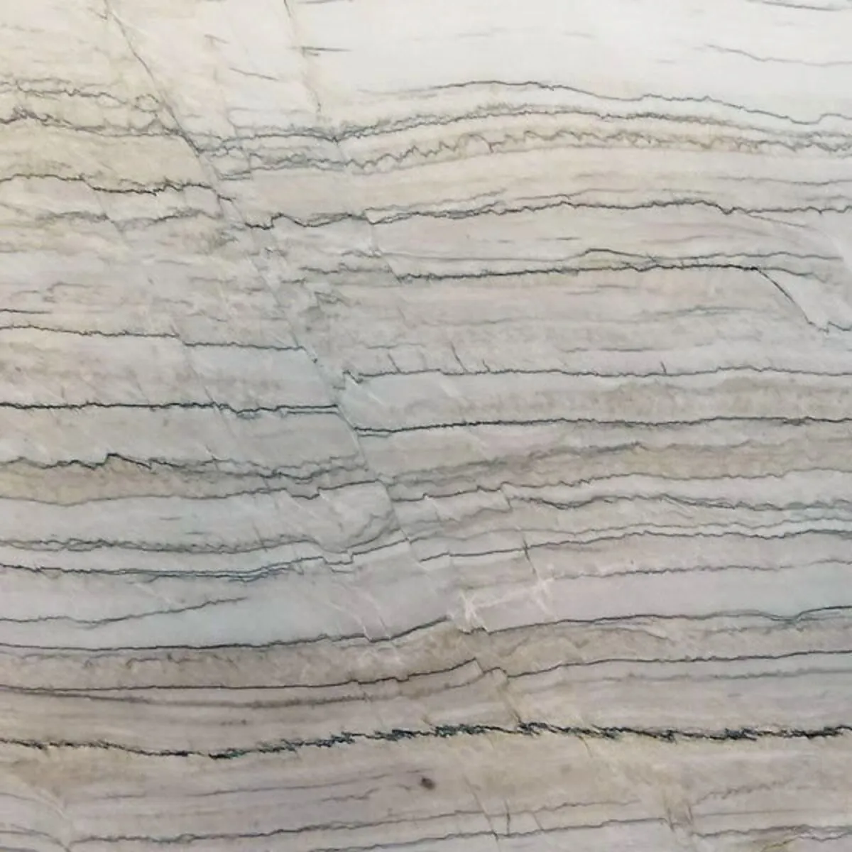 Closeup image of White Macaubas Grey Quartzite countertop slab