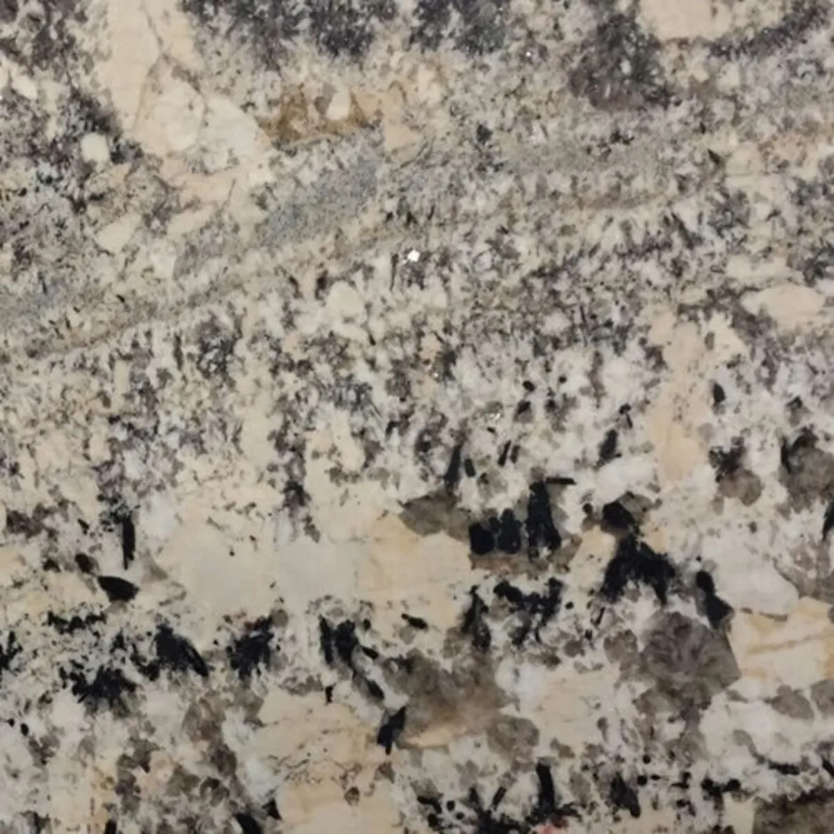Closeup image of White Persa Beige Granite countertop slab