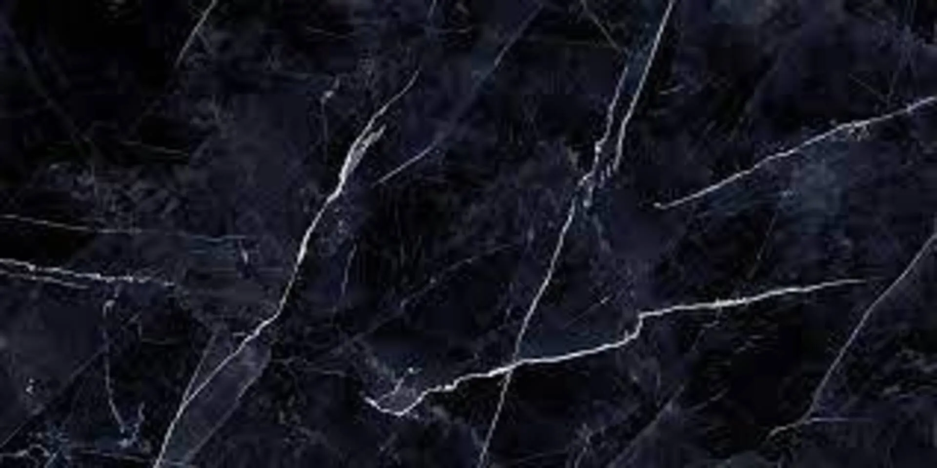Closeup image of Aggranite Porcelain Calacatta Black Lappato Black Porcelain countertop slab