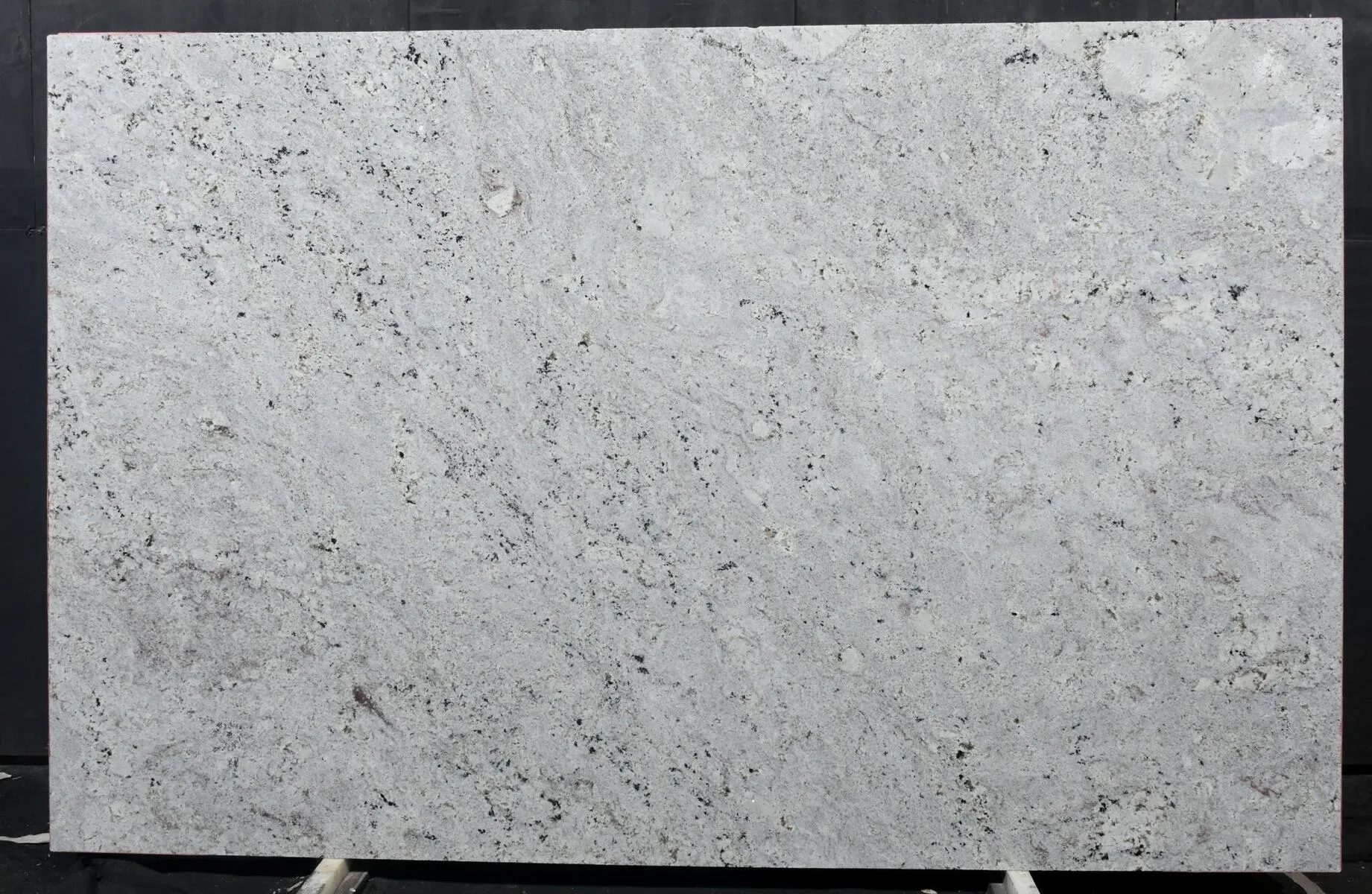 Closeup image of Andino White 1st Choice Grey Granite countertop slab