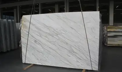 Closeup image of Calacatta Cremo White Marble countertop slab