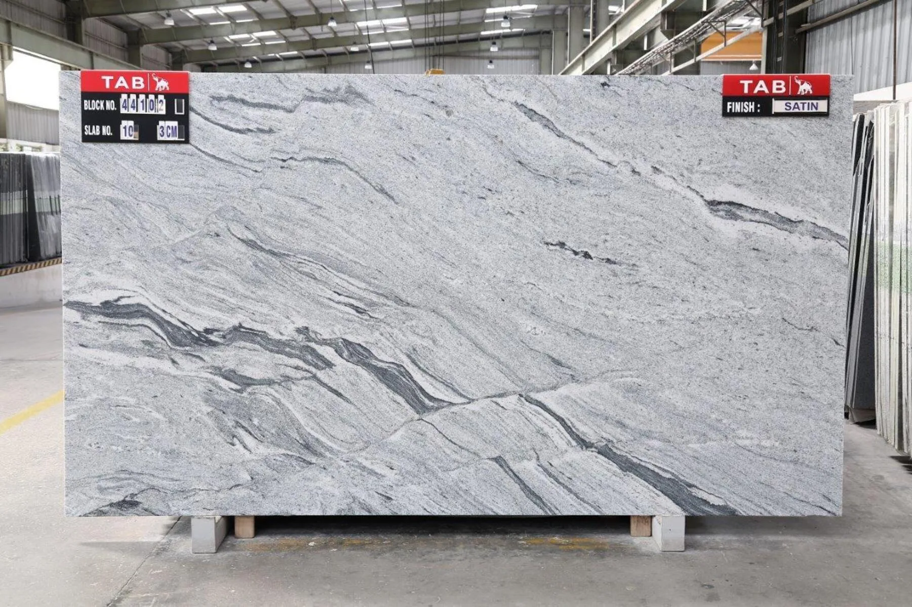 Closeup image of Cloudy White (Viscont White) Grey Granite countertop slab