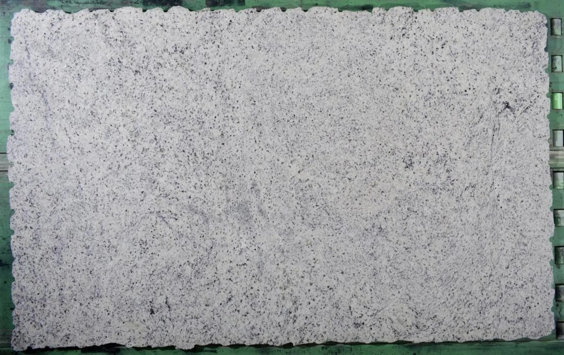 Closeup image of Dallas White Grey Granite countertop slab