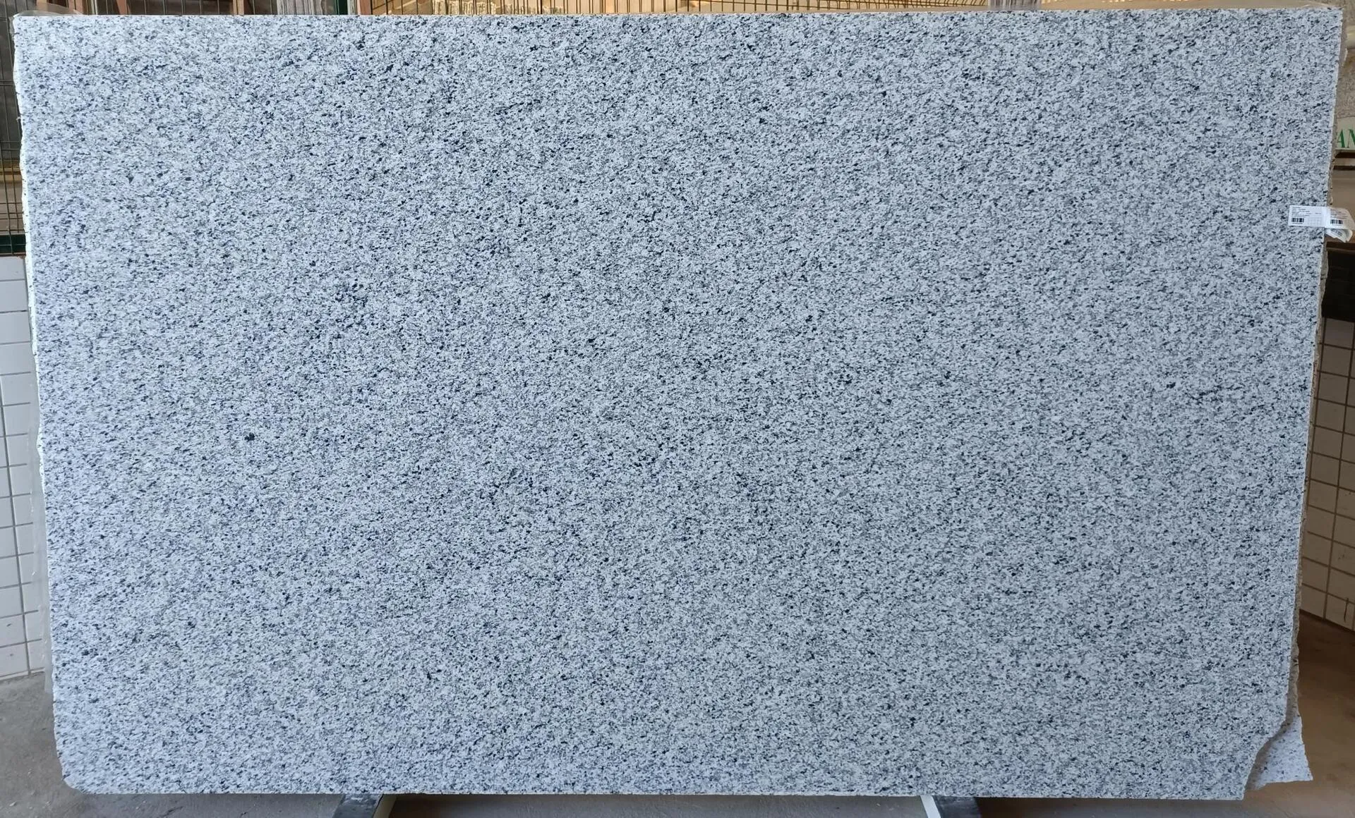 Closeup image of Luna Pearl Grey Granite countertop slab