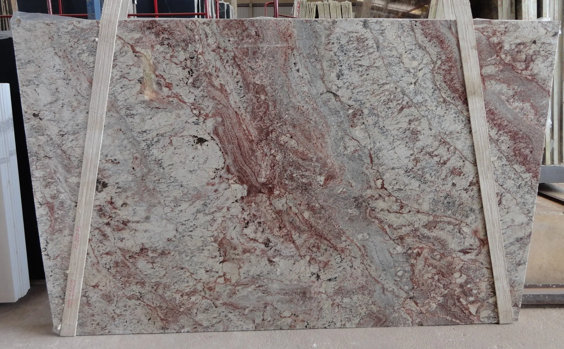 Closeup image of Typhoon Bordeaux 1st Choice Grey Granite countertop slab