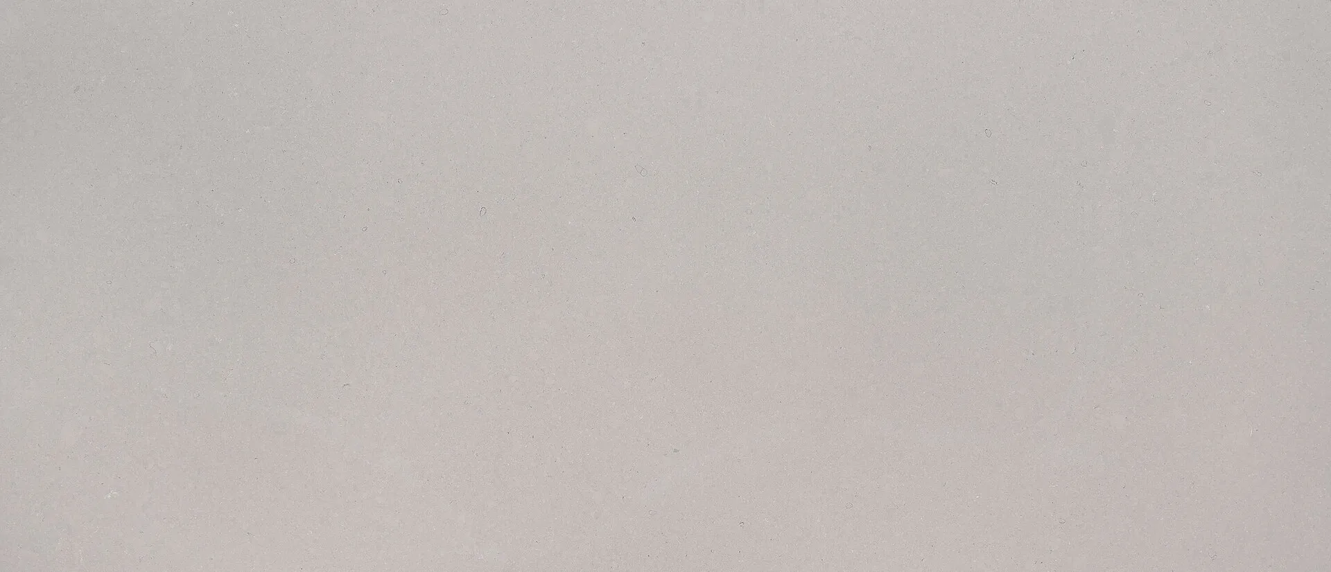 Closeup image of Q Quartz Fossil Gray Matte Grey Quartz countertop slab