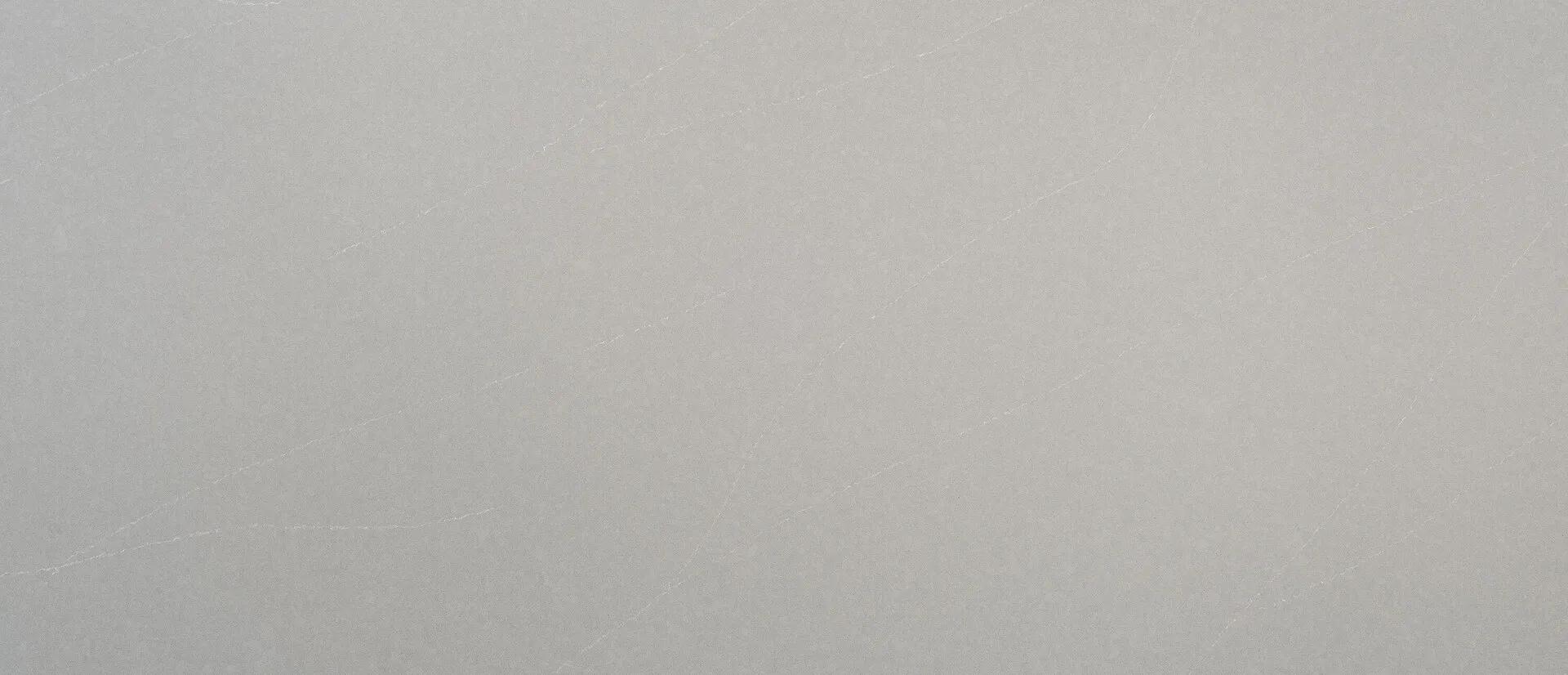 Closeup image of Q Quartz Soapstone Mist Concrete Grey Quartz countertop slab