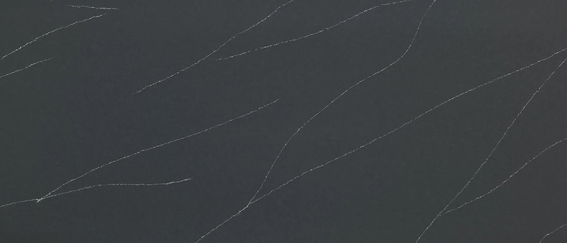 Closeup image of Q Quartz Soapstone Metropolis Concrete Black Quartz countertop slab