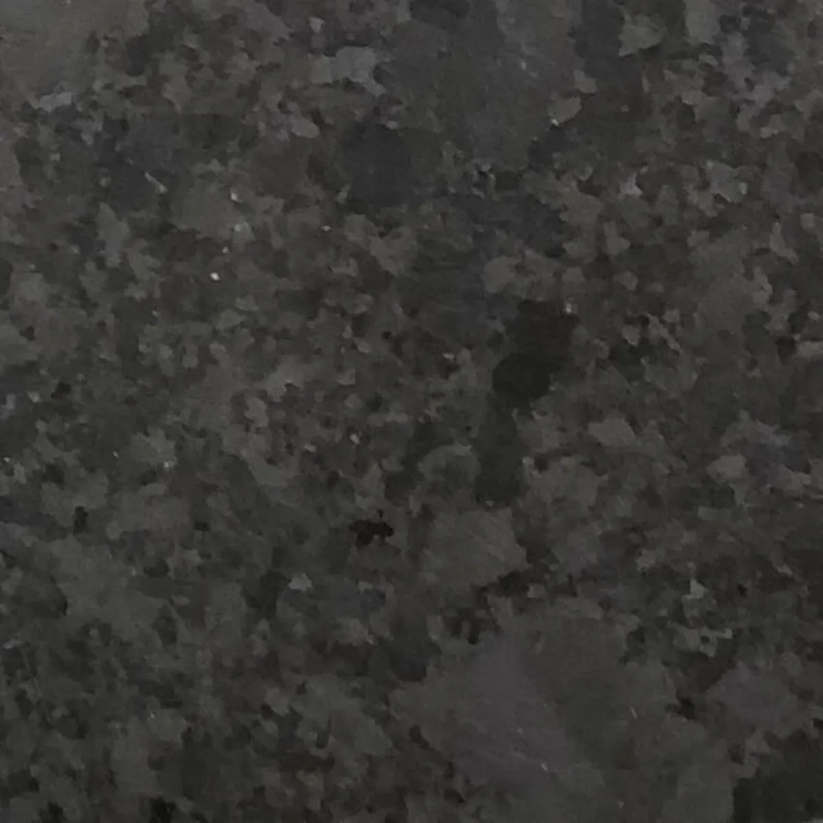 Closeup image of Antique Brown Black Granite countertop slab