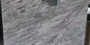 Closeup image of Glacier White 1st Choice Grey Granite countertop slab