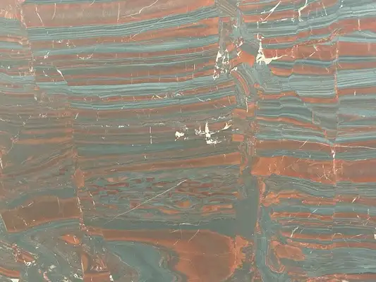 Closeup image of Iron Red Red Quartzite countertop slab