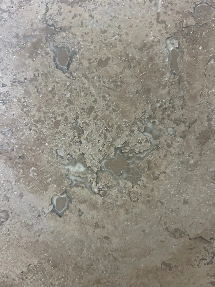 Closeup image of Noce H&F Brown Travertine countertop slab