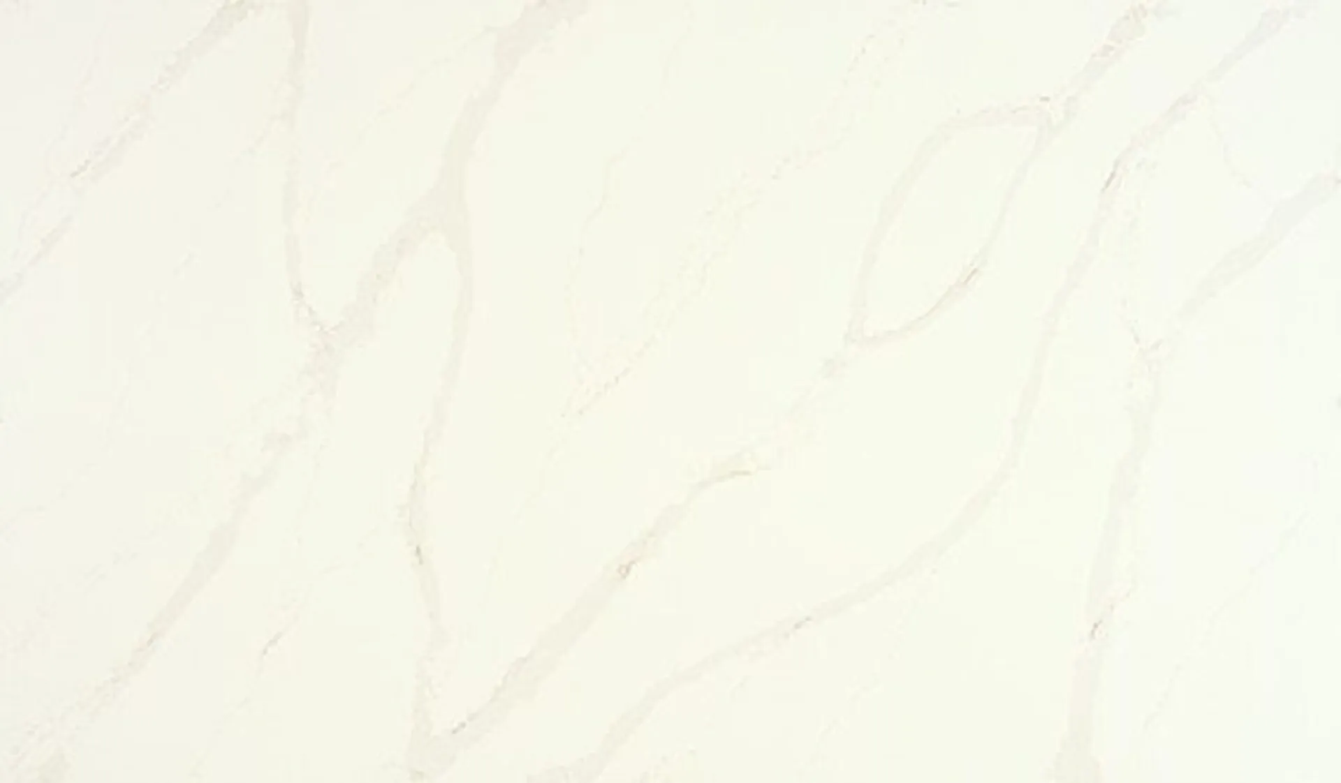 Closeup image of ONE Quartz Surfaces Calacatta Alabaster Cream Quartz countertop slab
