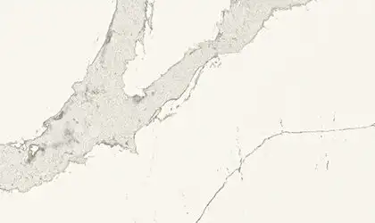Closeup image of ONE Quartz Surfaces Calacatta Wisteria White Quartz countertop slab