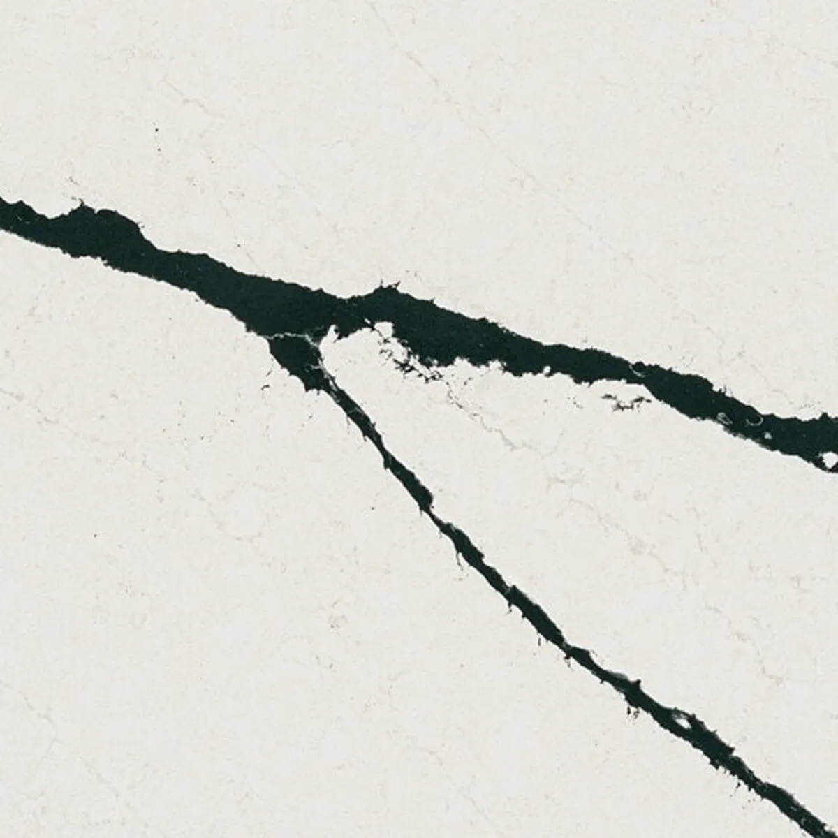 Closeup image of ONE Quartz Surfaces Calacatta Bolt White Quartz countertop slab
