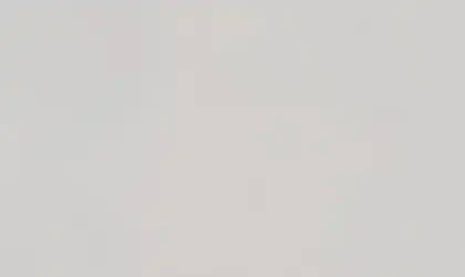 Closeup image of ONE Quartz Surfaces Lucent White White Quartz countertop slab