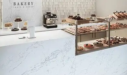 Image of installed ONE Quartz Surfaces Arabescato Mountain White Quartz countertops