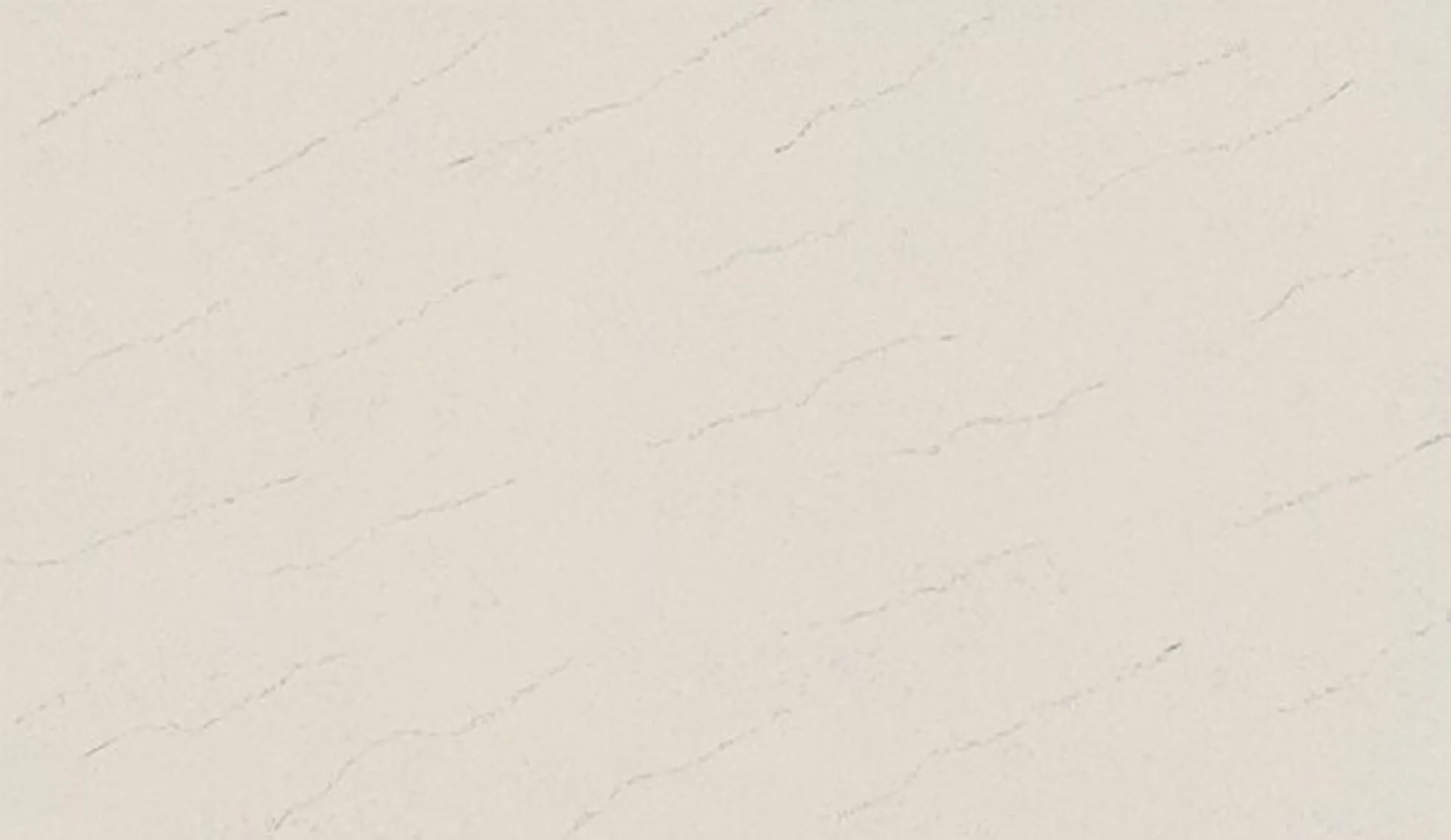 Closeup image of ONE Quartz Surfaces Carrara Veil Cream Quartz countertop slab