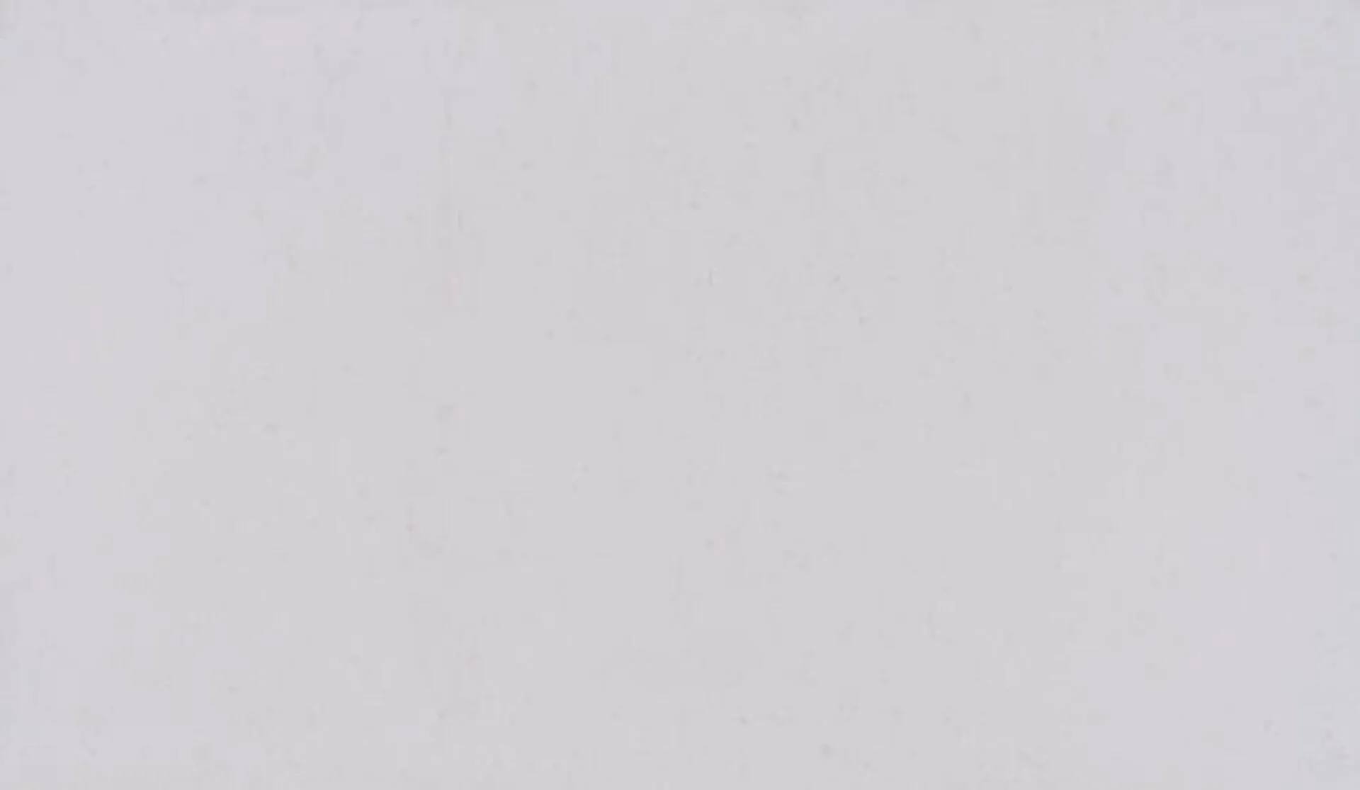 Closeup image of ONE Quartz Surfaces Carrara Roma White Quartz countertop slab