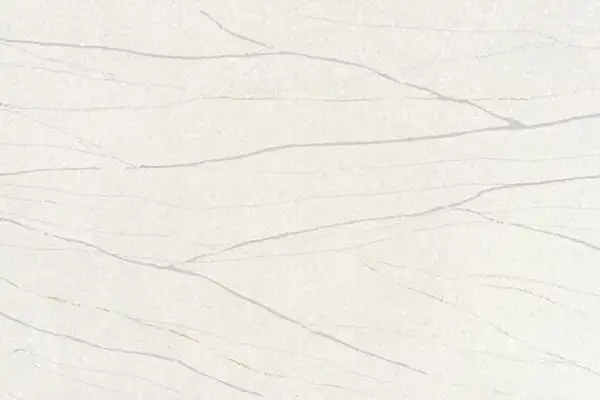 Closeup image of ONE Quartz Surfaces Monument White Cream Quartz countertop slab