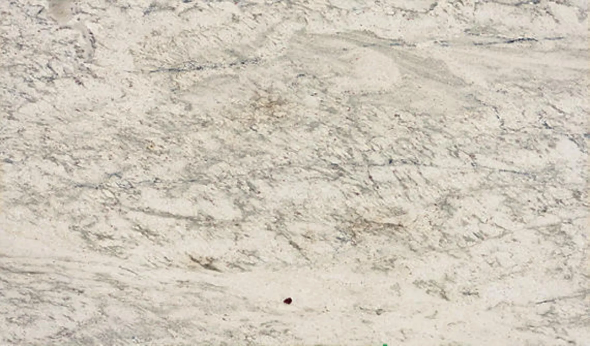 Closeup image of White Antico Cream Granite countertop slab