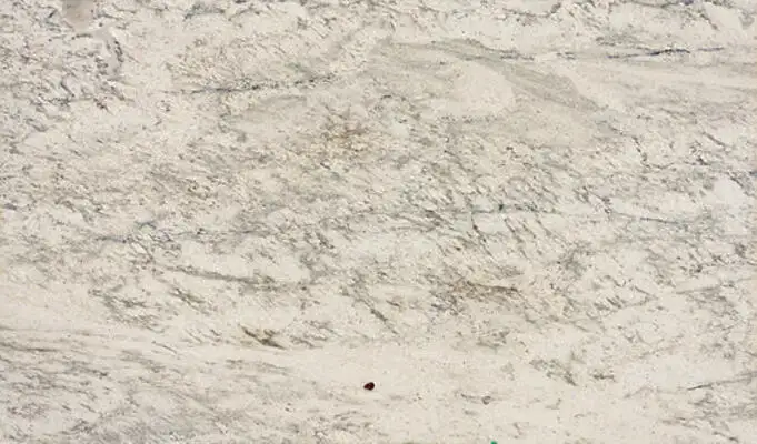 Closeup image of White Antico Cream Granite countertop slab