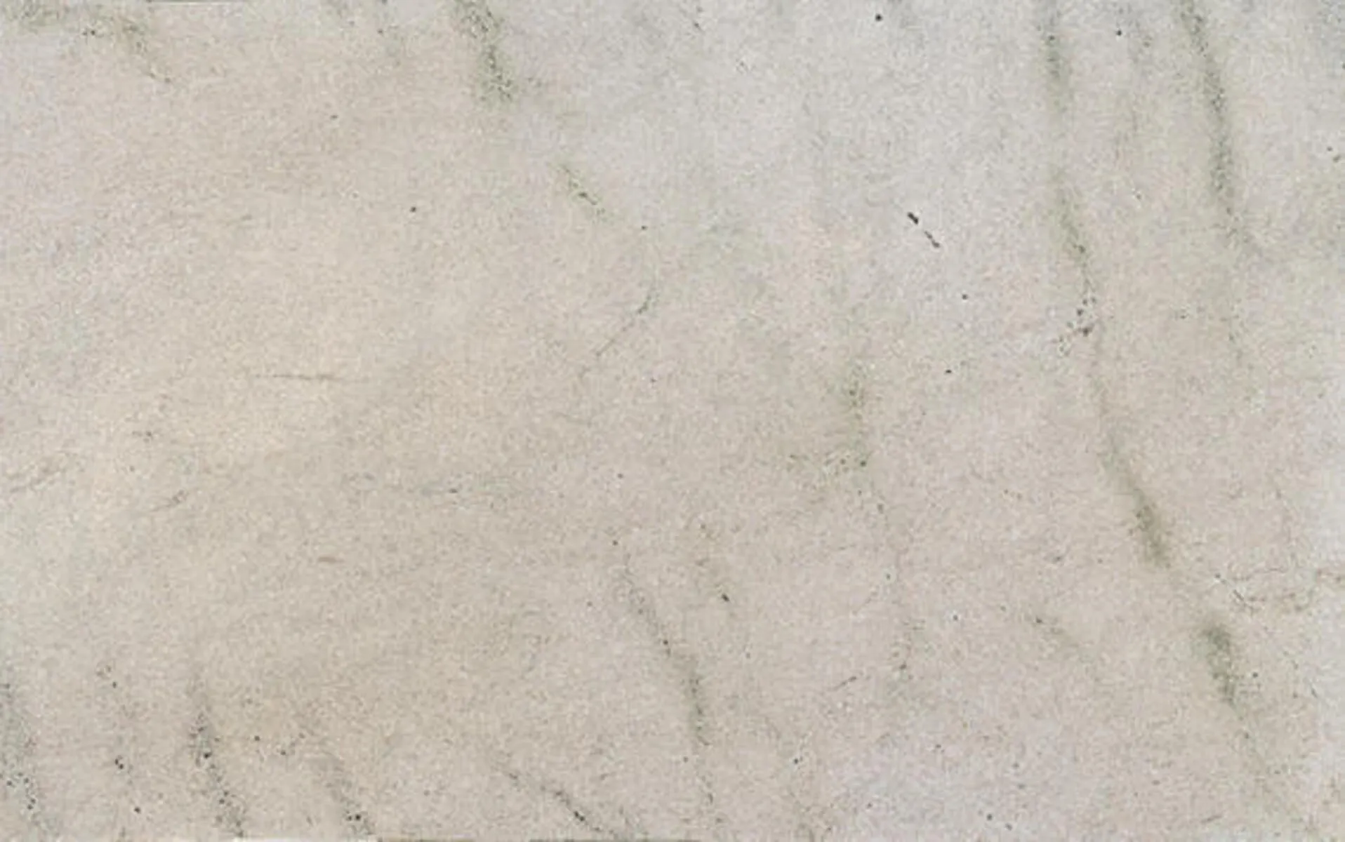 Closeup image of White Fantasy Beige Granite countertop slab