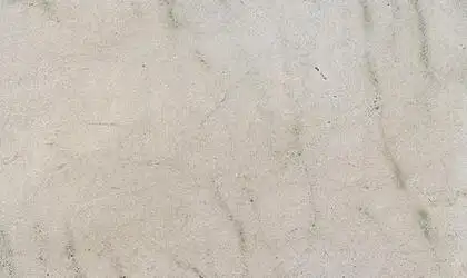 Closeup image of White Fantasy Beige Granite countertop slab
