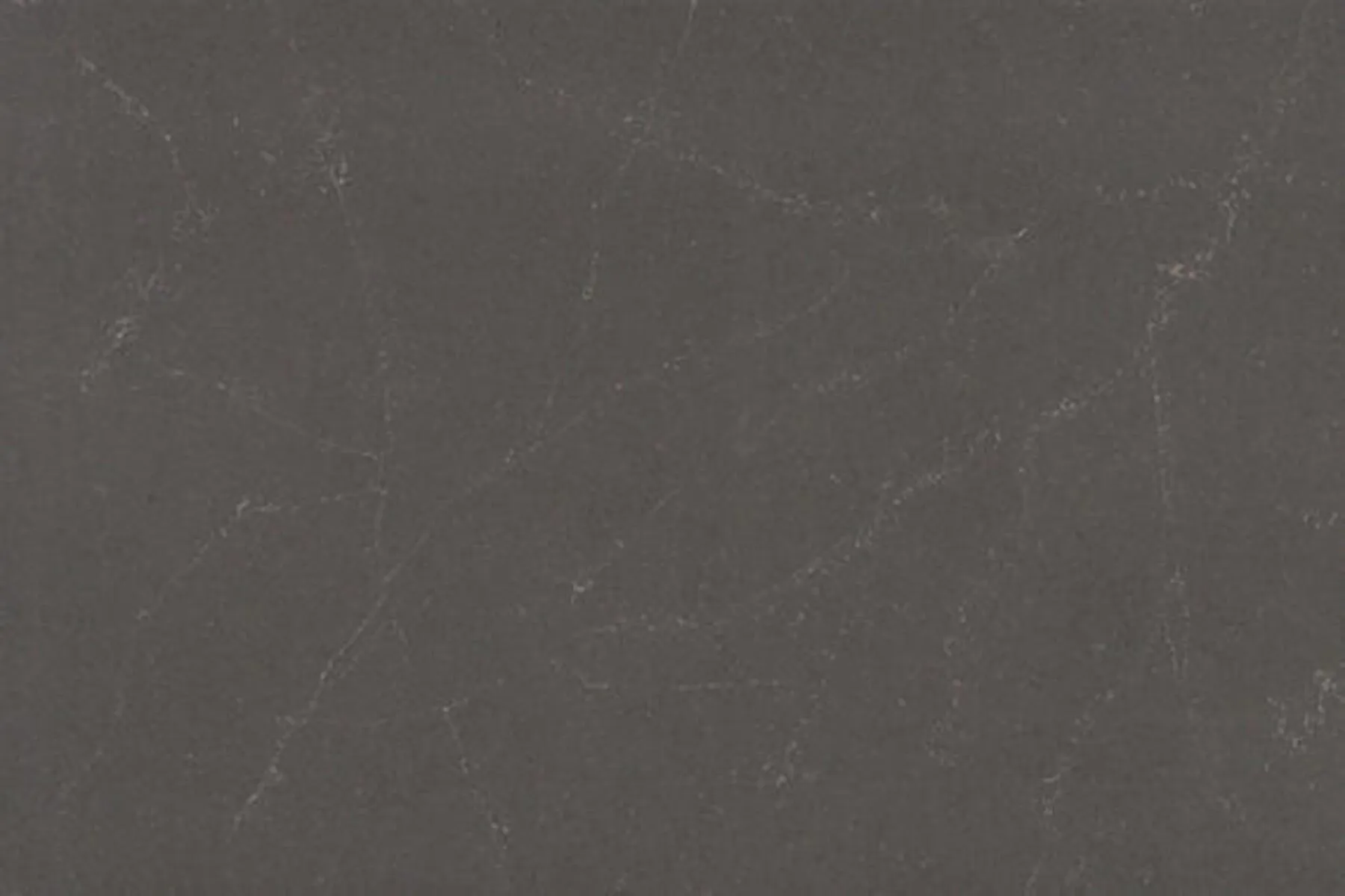 Closeup image of ONE Quartz Surfaces Sirius Grey Quartz countertop slab
