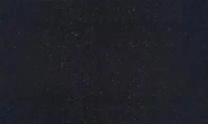 Closeup image of ONE Quartz Surfaces Nightfall Black Quartz countertop slab