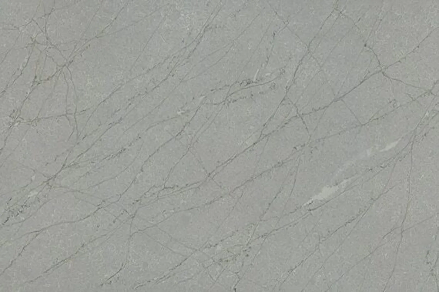 Closeup image of ONE Quartz Surfaces Amazonite Grey Grey Quartz countertop slab