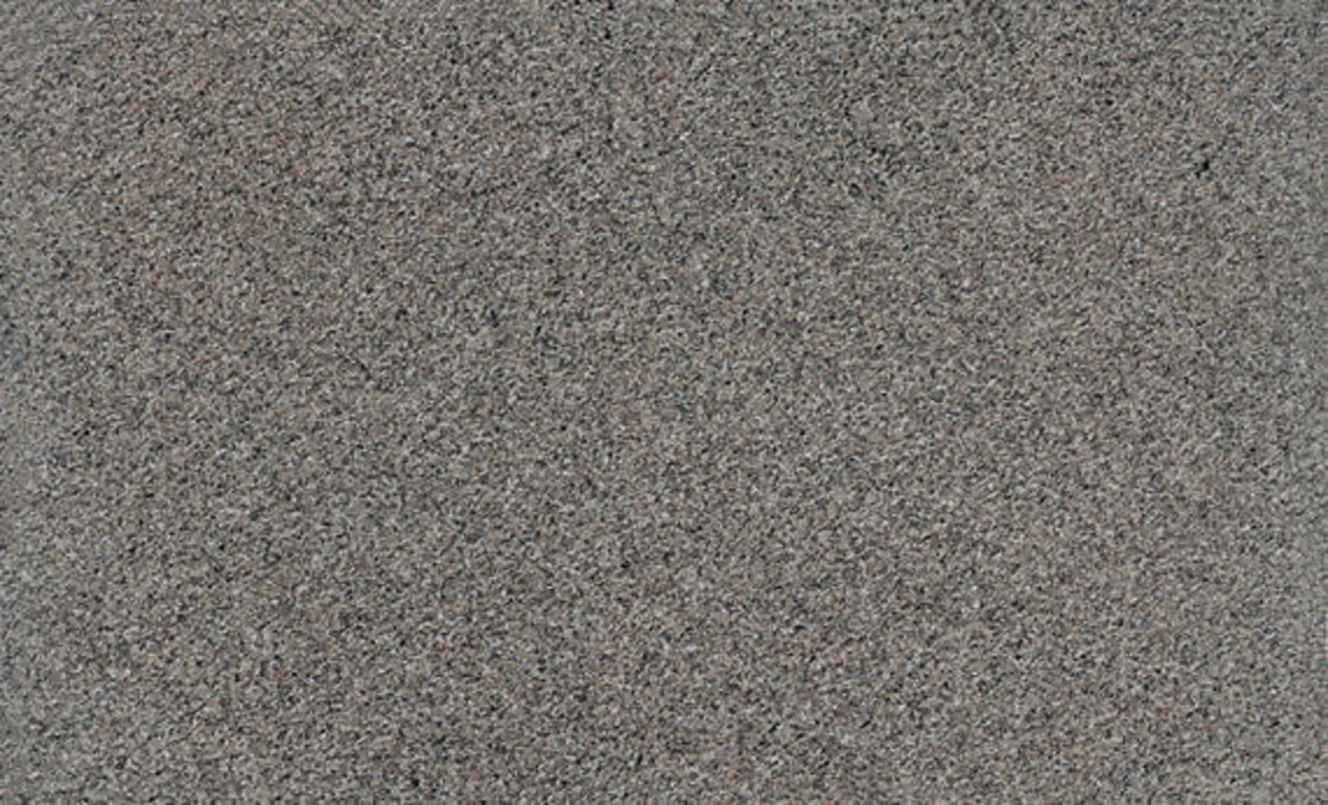 Closeup image of New Caledonia Brown Granite countertop slab